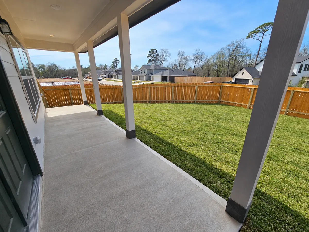Completed extended rear porch at Alta's Cypress home on 11803 Serena's Song Drive