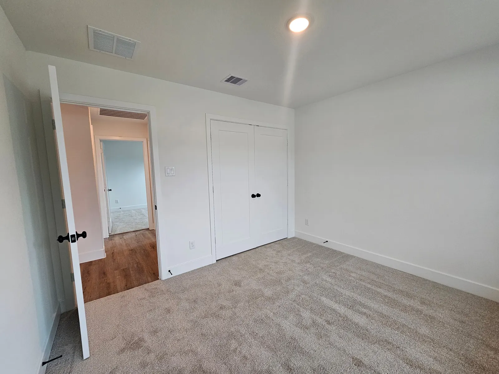 Bedroom with walk in closet at 10727 Crockett Meadows, Conroe, TX