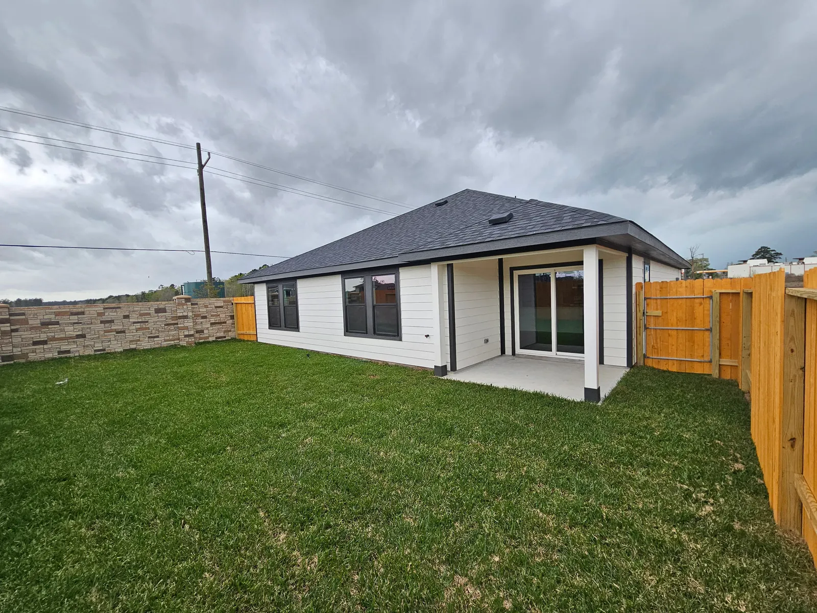Backyard and rear elevation at 10727 Crockett Meadows, Conroe, TX