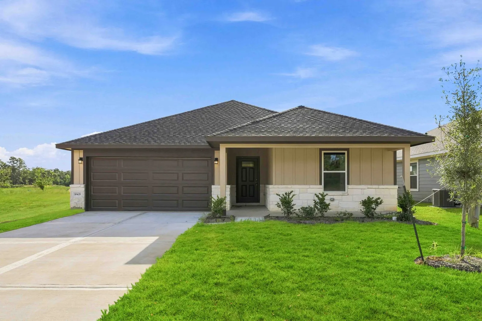 Front exterior of 10435 Sugar Mill Drive, a new home by Alta Homes, Conroe, TX