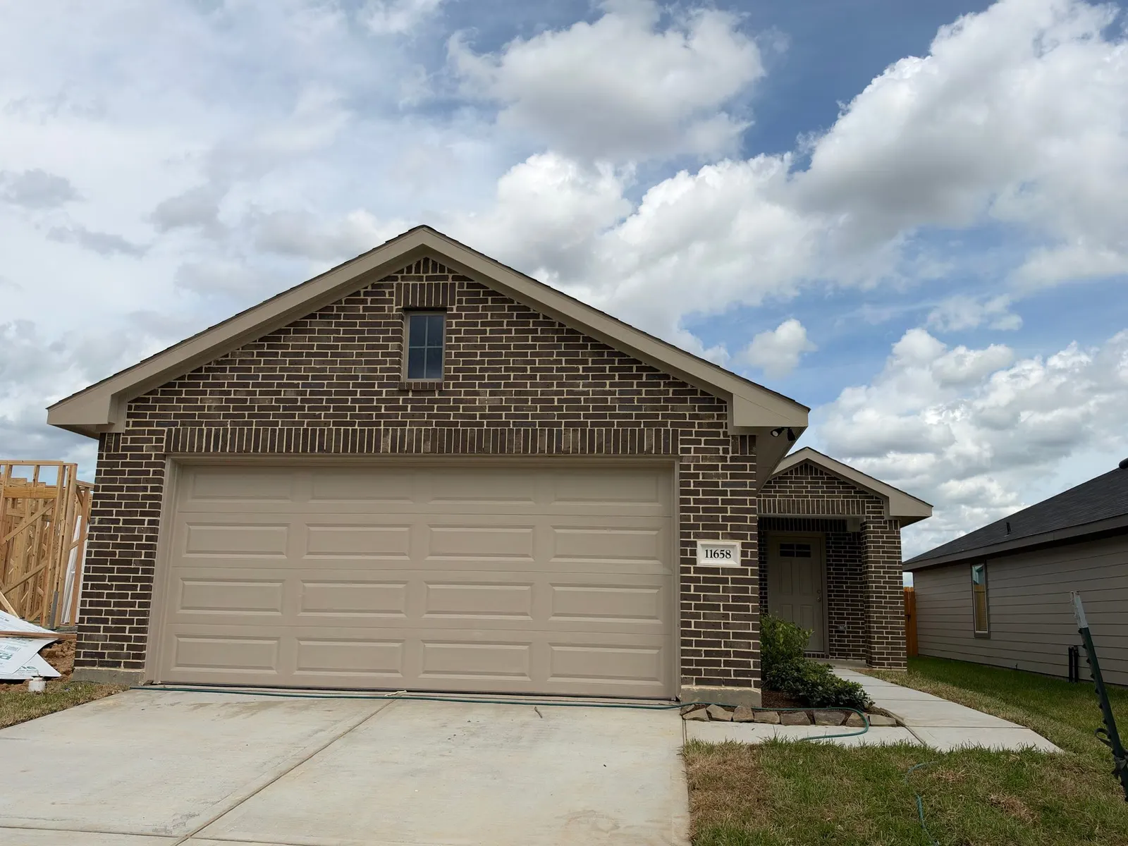 Front exterior of 11658 Ruffian Drive, a new home by Alta Homes, Willis, TX