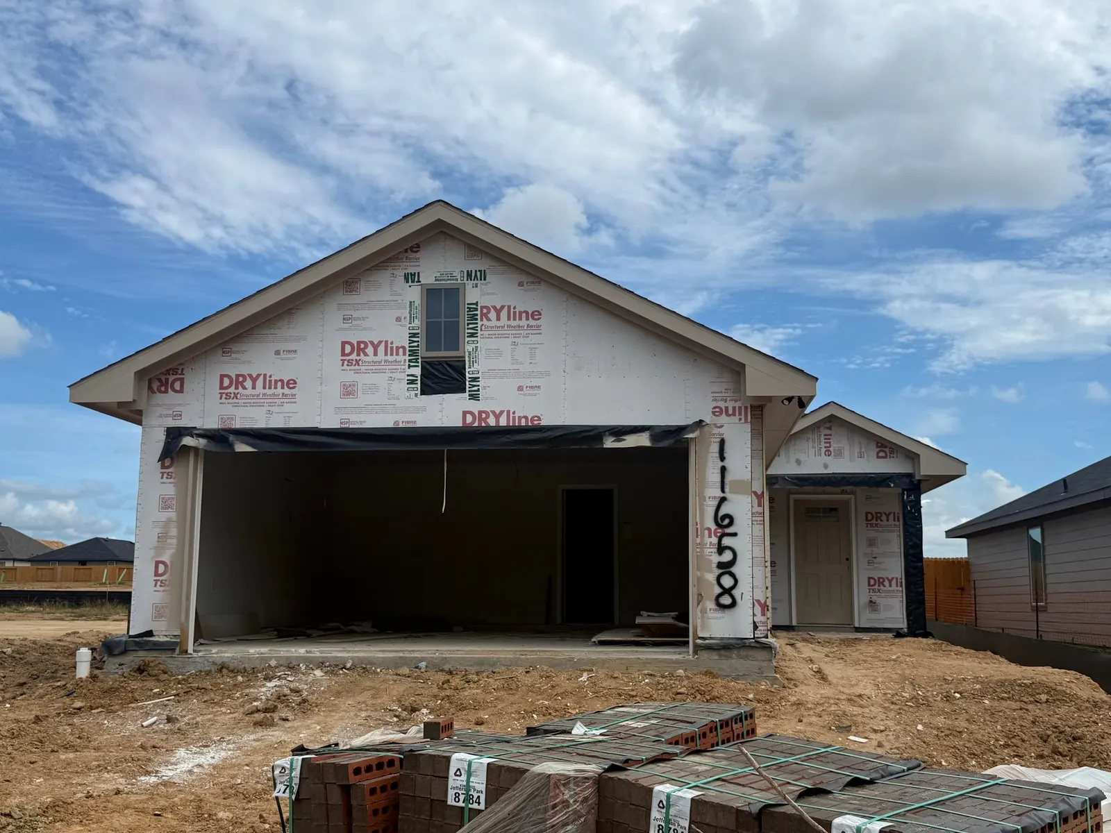 Front exterior of 11658 Ruffian Drive, a new home by Alta Homes, Willis, TX