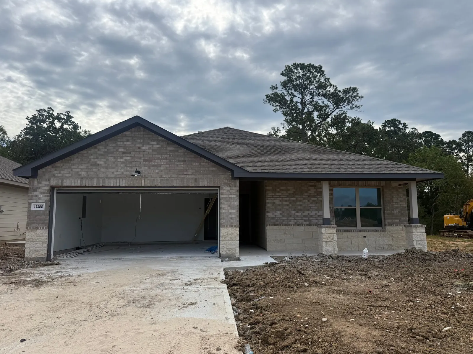 Front exterior of 12200 Lexington Heights Drive, a new home by Alta Homes, Willis, TX