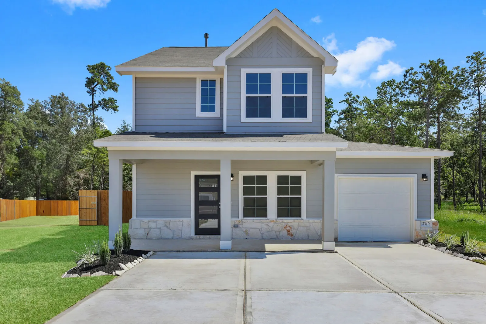 Two story front exterior with garage