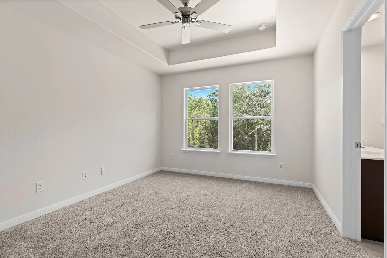 Carpeted bedroom with window