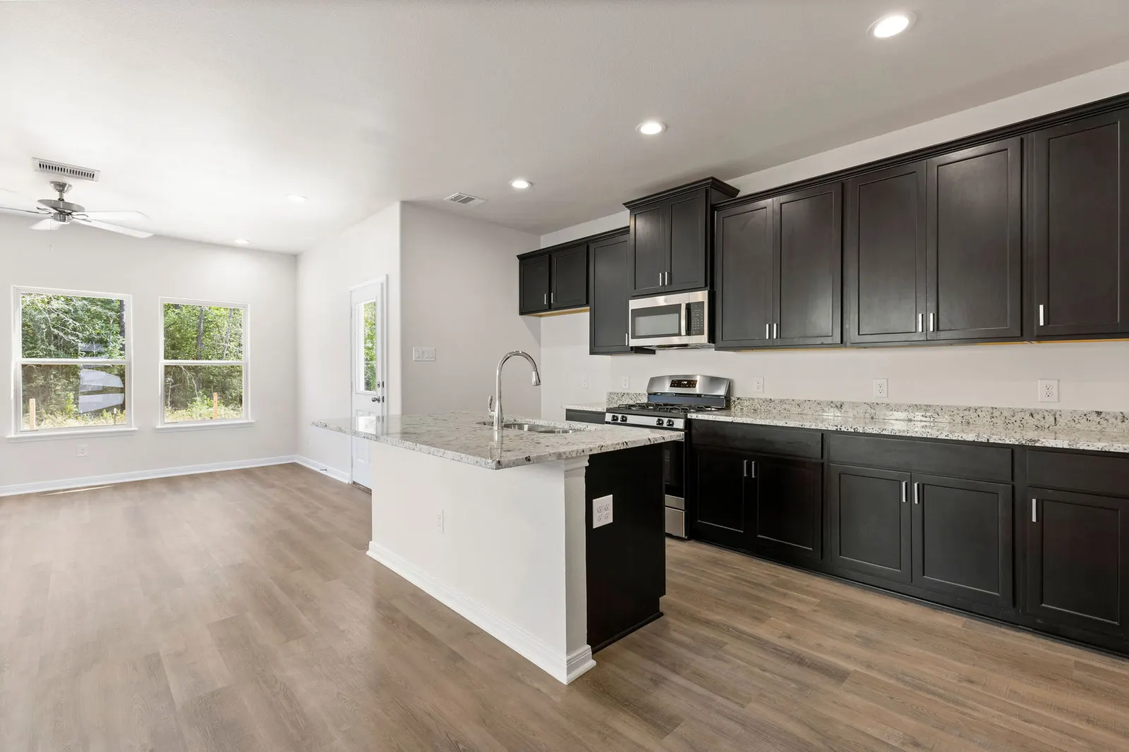 Kitchen with dark cabinets and island
