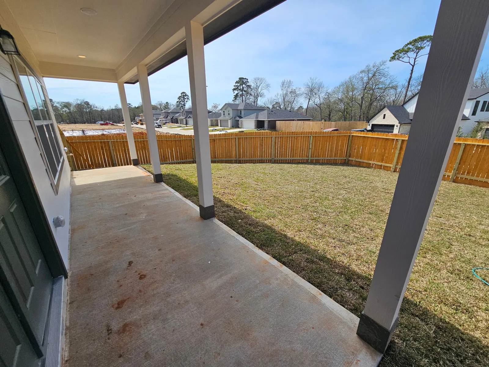 Covered back patio at 11803 Serena's Song Drive, Willis, TX